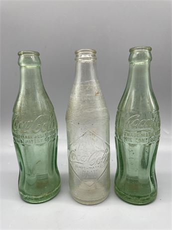 Three (3) Vintage Coke Bottles