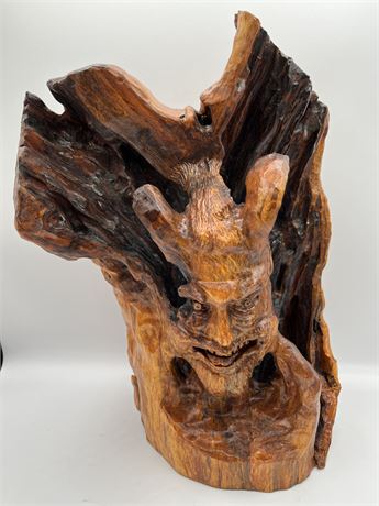 Carved Wood Face in Tree Sculpture