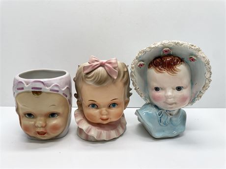 Three (3) Baby Head Vases