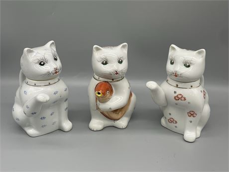 A Trio of Porcelain Cats