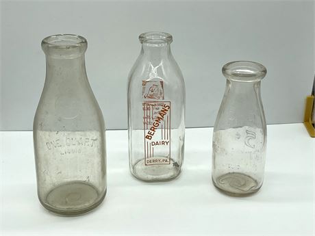 Three (3) Milk Bottles