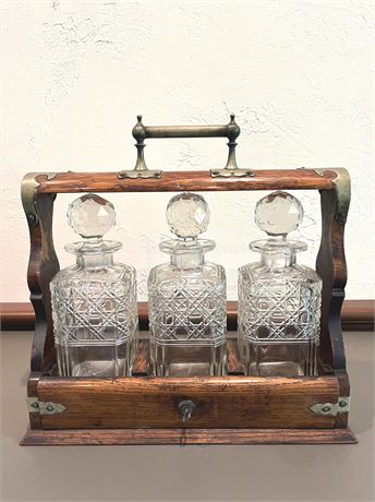 Antique Oak & Brass Tantalus with 3 Crystal Decanters